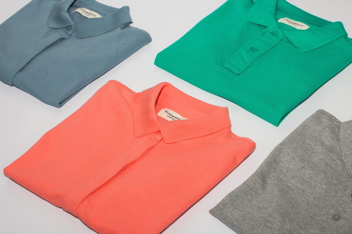 green crew neck shirt and gray crew neck shirt
