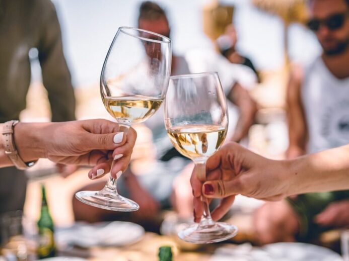 two women holding glass of champagnes