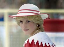 a woman in a red and white dress and hat