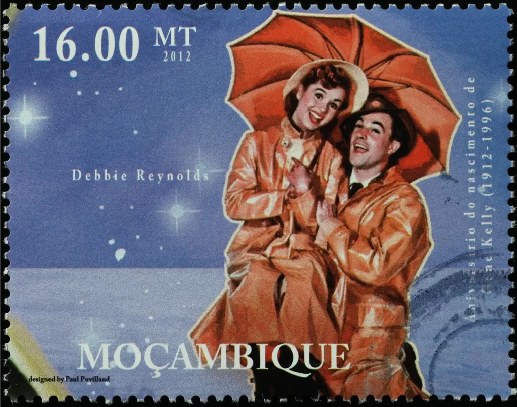 - VIPshow Poštovní známka z Mosambiku zobrazuje Debbie Reynolds a Genea Kellyho s oranžovým deštníkem jako poctu muzikálu Zpívání v dešti, který se stal kulturním fenoménem