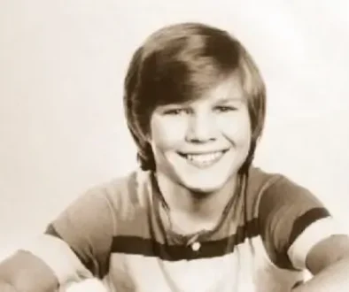 Archivní portrét mladého Pavla Horňáka s úsměvem